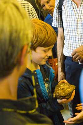 Holding the Society's meteorite